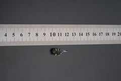 Green Tourmaline pendant shown beside ruler for scale with deep green crystal in oxidized silver claw setting.