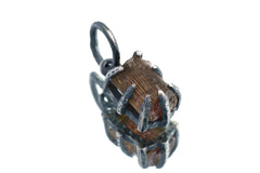 Watermelon Tourmaline pendant on white background showing handmade oxidized silver claw frame and earthy crystal colour.