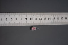 Watermelon Tourmaline pendant shown beside ruler for scale with pink-green crystal in oxidized silver claw setting.