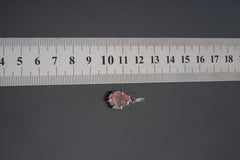 Watermelon Tourmaline pendant shown worn close to the collarbone with pink and green gemstone in claw setting.