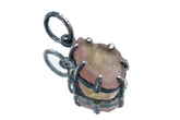 Watermelon Tourmaline Claw Pendant on white background with oxidized sterling silver setting and natural pink-green stone.