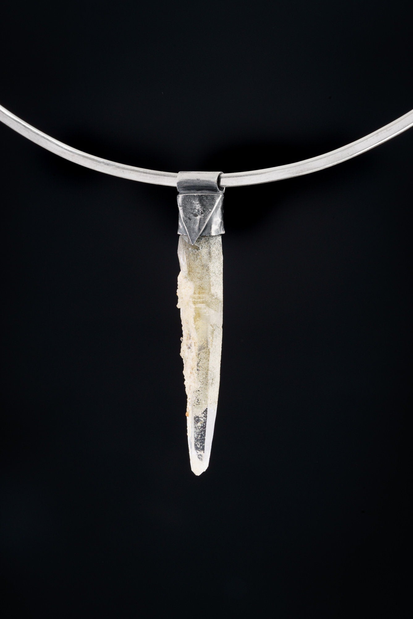 Nepal Chlorite Rutile Phantom Quartz Stack Pendant shown on black background with oxidized sterling silver cap and clear crystal point.