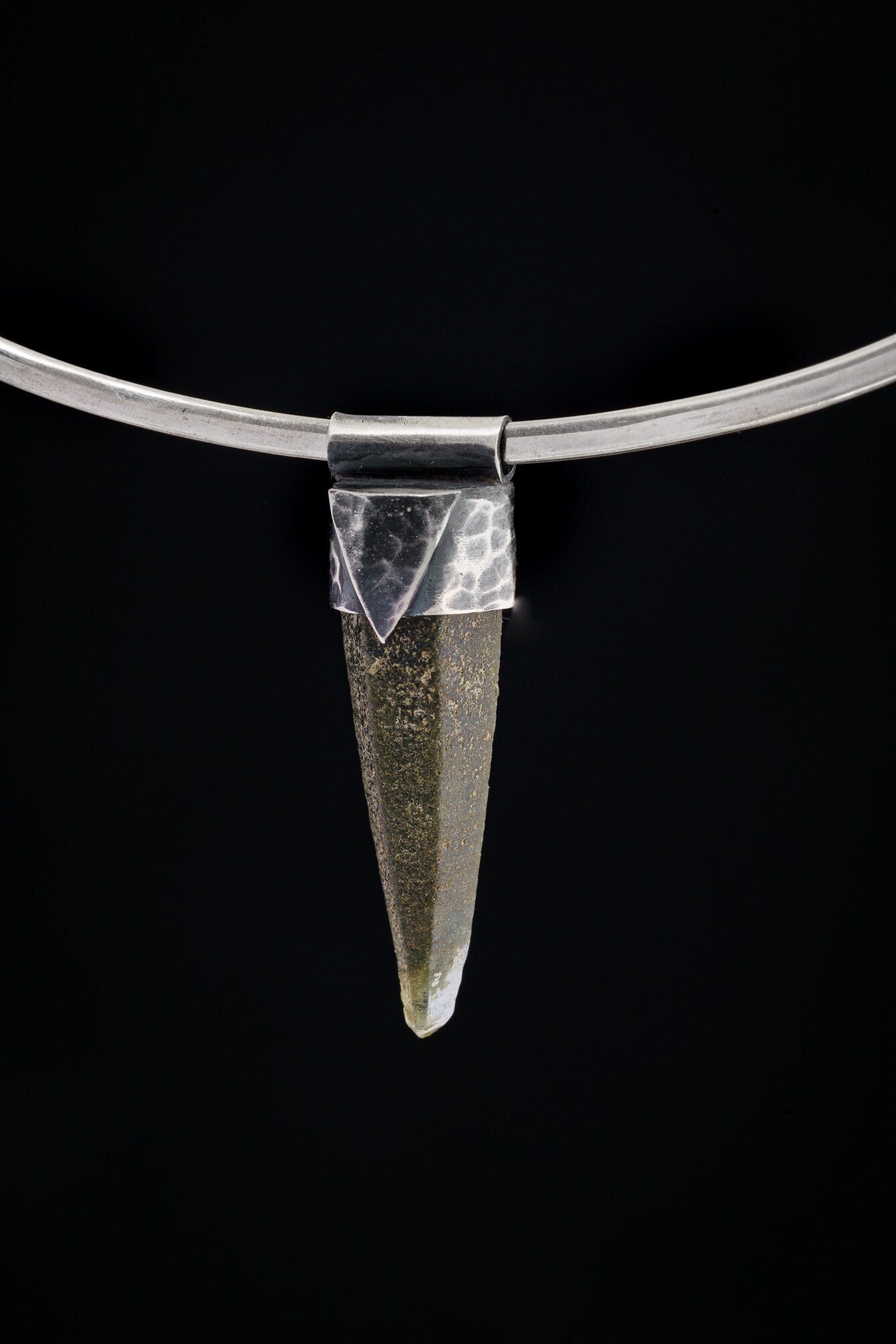 Nepal Chlorite Rutile Phantom Quartz Stack Pendant shown on black background with oxidized sterling silver cap and clear included crystal point.