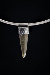 Nepal Chlorite Rutile Phantom Quartz Stack Pendant shown on black background with oxidized sterling silver cap and clear included crystal point.