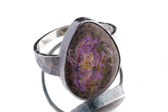 Sugilite ring in oxidized 925 sterling silver with hammered texture, open-back bezel, and deep purple gemstone.