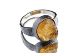 Citrine ring in oxidized 925 sterling silver with hammered texture, open-back bezel, and warm golden quartz stone.