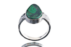 Malachite ring in oxidized 925 sterling silver with hammered texture, open-back bezel, and bold green banded stone.