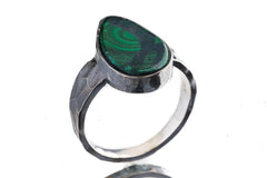Front view of Malachite oxidized silver ring showing rich green banding and rugged hammered sterling silver profile.