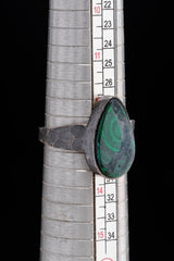 Malachite ring shown beside a ruler for scale, with oxidized 925 sterling silver and strong green focal stone.