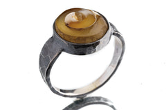 Side view of Fossil Shell oxidized silver ring showing raised bezel setting and strong masculine profile.