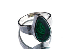 Side view of Malachite ring showing oxidized hammered silver texture, raised bezel setting, and solid ring profile.