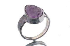 Side view of Amethyst ring showing oxidized sterling silver texture, raised bezel setting, and strong ring profile.