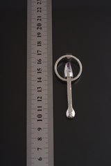 Vera Cruz Amethyst sterling silver spoon pendant shown beside a ruler for scale with solid cast silver body.