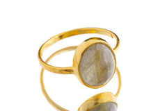 Gold-plated Labradorite ring shown from the side with smoky gemstone body tone and warm polished silver finish.