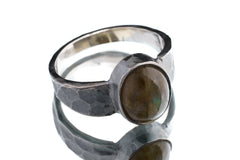 Mystic Oculus Labradorite ring in oxidized 925 sterling silver with circular flashing stone and bark-like texture.