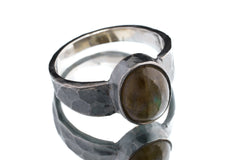Mystic Oculus Labradorite ring in oxidized 925 sterling silver with circular flashing stone and bark-like texture.