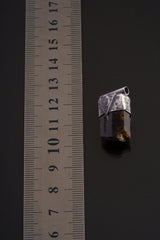 Himalayan Dravite Tourmaline Stack Pendant shown beside a ruler for scale with 2.5 mm tubular bail and oxidized silver cap.