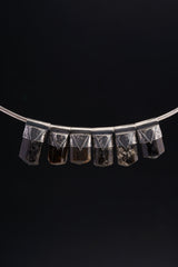 Himalayan Dravite Tourmaline Stack Pendants shown together on black background with oxidized silver caps and smoky brown-black stones.