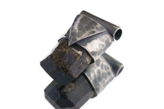 Himalayan Dravite Tourmaline Stack Pendant shown on light background with smoky brown-black crystal and oxidized silver cap.