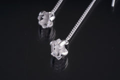 Close-up of Herkimer Diamond Quartz earring showing claw-set crystal, polished silver, and natural sparkle.