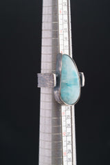 Larimar oxidized silver ring shown beside a ruler for scale, with rugged hammered 925 sterling silver construction.