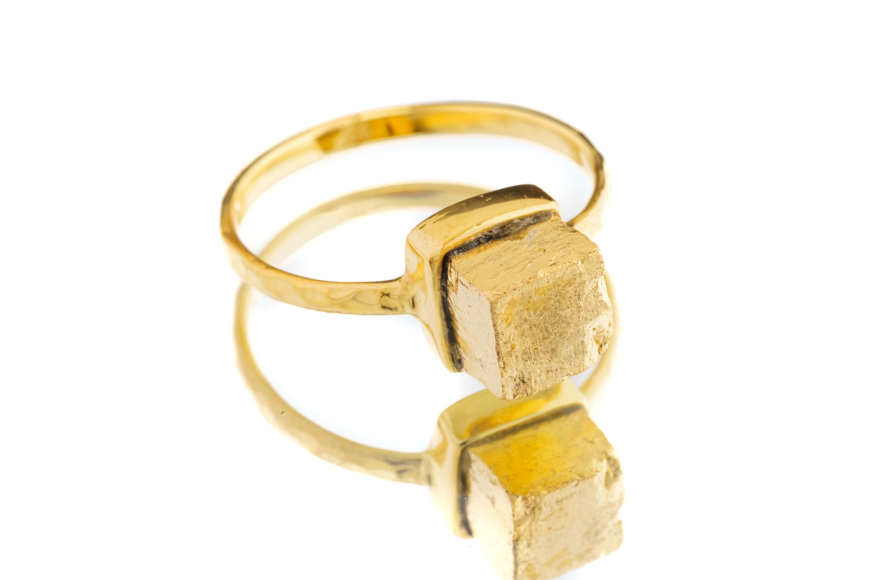 Gold-plated Pyrite silver ring shown on a white background, with square golden mineral stone and sturdy handmade band.