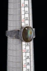 Mystic Oculus Labradorite ring shown beside a ruler for scale, with oxidized 925 sterling silver and circular gemstone.