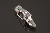 Two Sided Crystal Spinner Pendant shown on black background with high-polish sterling silver and mixed gemstone construction.