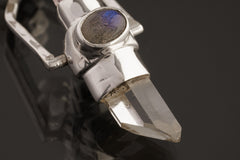 Two Sided Crystal Spinner Pendant shown on black background with Himalayan Clear Quartz, Amethyst, and sterling silver spinner setting.