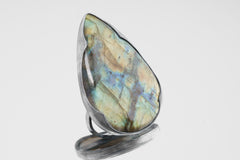 XXL Labradorite adjustable ring in shiny 925 sterling silver with large flashing stone and thick waved bezel setting.