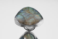 Front view of XXL Labradorite statement ring showing large blue-green flash and thick polished sterling silver setting.