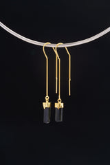 Single gold-plated Tourmaline dangle earring displayed on a choker with slim black crystal and fine hook.