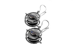 Labradorite Circle earring shown on a white background with layered sterling silver portal setting.
