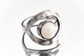 Pearl adjustable loop ring in textured 925 sterling silver shown close-up on a white background with soft organic lustre.