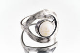 Pearl adjustable loop ring in textured 925 sterling silver shown close-up on a white background with soft organic lustre.