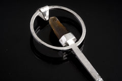 Close-up of Citrine Point spoon pendant showing hammered sterling silver texture and pointed golden crystal setting.