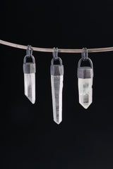 Three hand fossicked Australian Clear Quartz point pendants in oxidized 925 sterling silver, shown on black with coil bails.