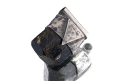 Himalayan Dravite Tourmaline Stack Pendant shown on a light background with oxidized sterling silver cap and dark terminated crystal.