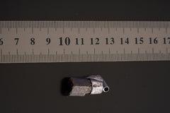 Himalayan Dravite Tourmaline Stack Pendant shown beside a ruler for scale with oxidized silver cap and dark crystal body.