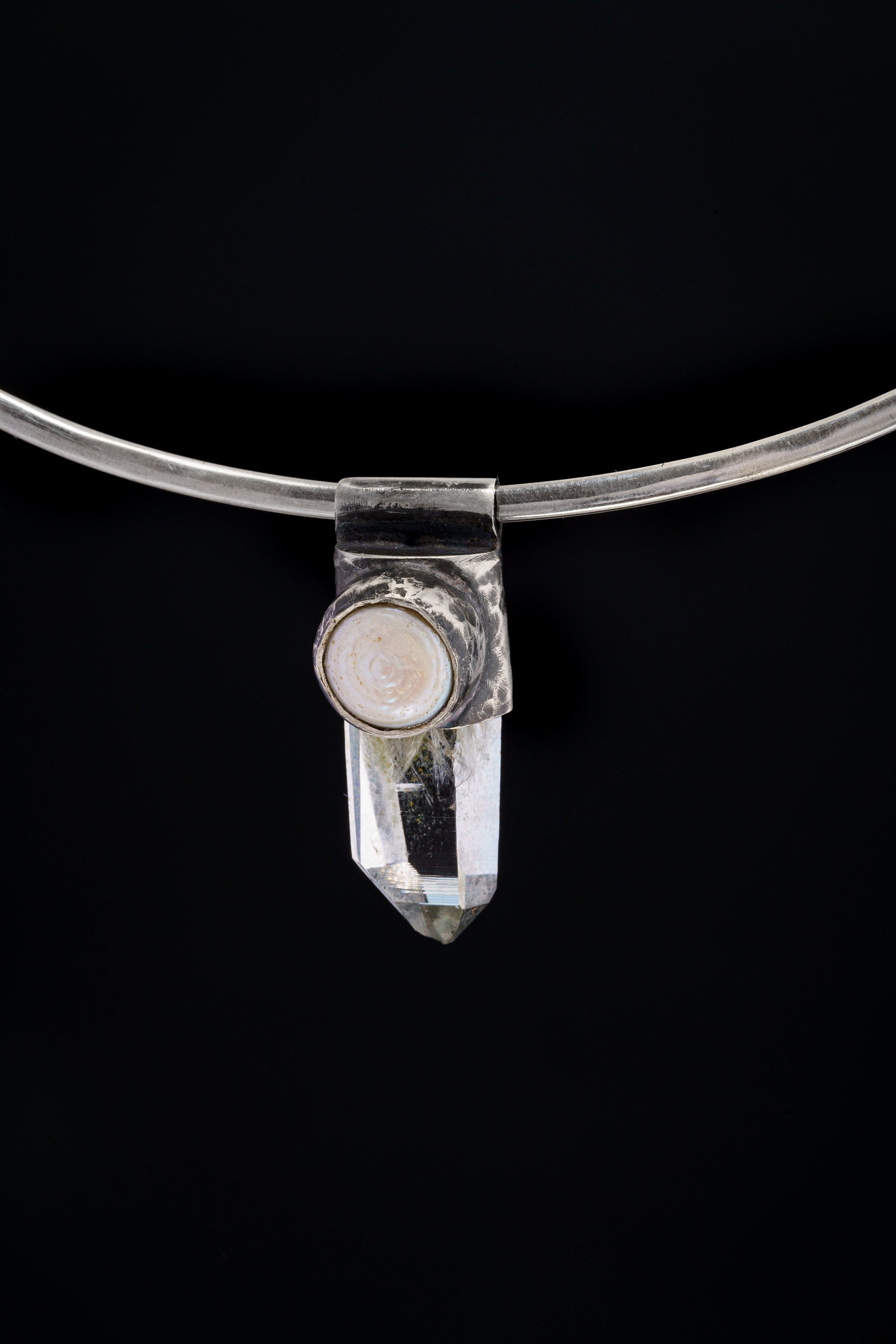 Nepal Inclusion Quartz South Sea Pearl Stack Pendant shown on black background with oxidized sterling silver cap and clear crystal body.