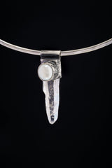 Nepal Inclusion Quartz South Sea Pearl Stack Pendant shown on black background with oxidized sterling silver cap and clear crystal point.