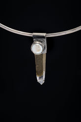 Nepal Inclusion Quartz South Sea Pearl Stack Pendant shown on black background with oxidized sterling silver cap and clear crystal point.