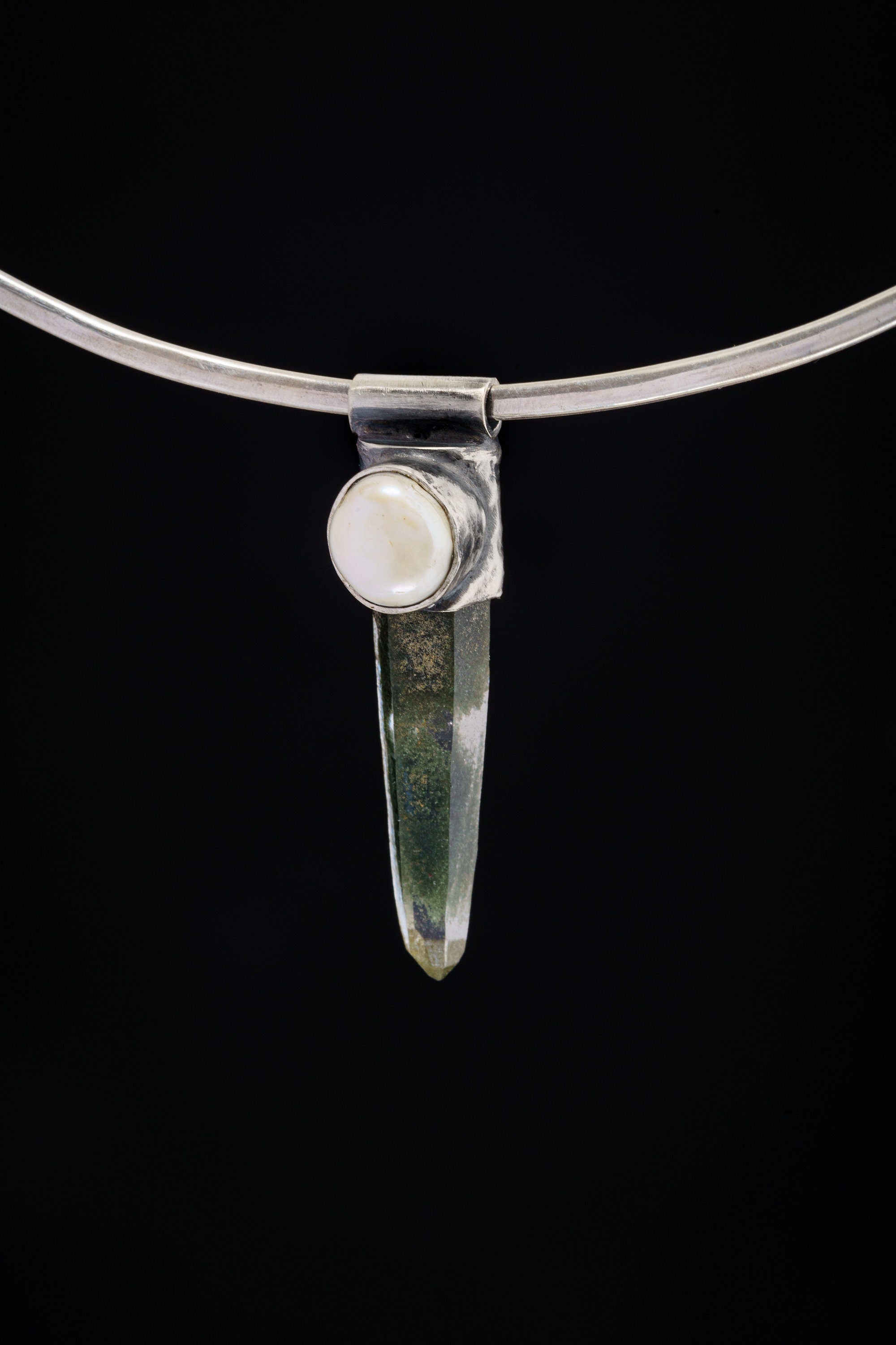 Nepal Inclusion Quartz South Sea Pearl Stack Pendant shown on black background with oxidized sterling silver cap and clear green-toned crystal.