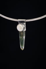 Nepal Inclusion Quartz South Sea Pearl Stack Pendant shown on black background with oxidized sterling silver cap and clear green-toned crystal.