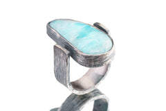 Side view of Larimar ring showing rock-hammered oxidized sterling silver, raised bezel setting, and strong profile.