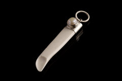 South Sea Pearl Antique Bone Spoon Pendant shown on dark background with sterling silver cap and carved bone scoop.