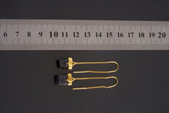 Pyrite dangle earrings shown beside a ruler for scale, with gold-plated sterling silver hooks and bezel settings.