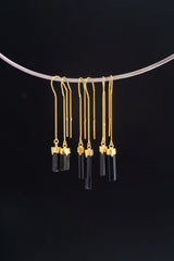 Gold-plated Tourmaline dangle earrings shown on a silver choker, with slim black crystal drops and 925 silver hooks.