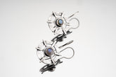 Old World Labradorite Circle Cross earrings in hammered 925 sterling silver with bezel-set stones and layered dangle design.