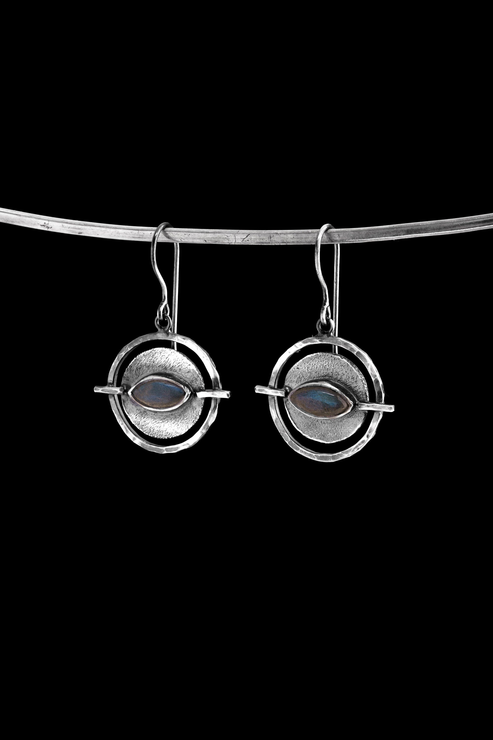 Old World Labradorite Circle single earring in hammered 925 sterling silver shown worn on the ear.